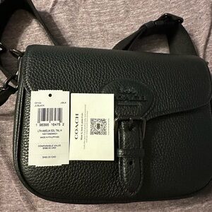 NWT used one time Coach Amelia Saddle Bag Pebbled Leather/Black Copper/Black